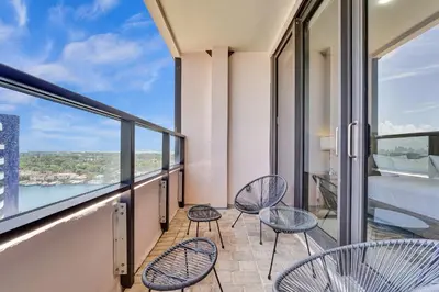 a balcony with chairs and a view of the water at Luxury Penthouse 3BR 3BA Oceanfront PH7 in Miami Beach