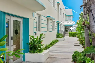 a walkway in front of a building at Luxuri Suites in Miami Beach