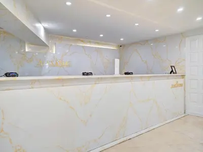a bar in a room with a marble wall at Adorable 2 Bedroom Condo Beach Service 904 in Miami Beach