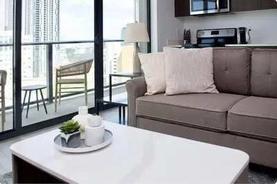 a living room with a couch and a table at The Bayfront V in Miami