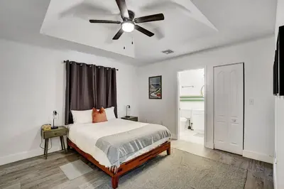 a bedroom with a bed and a ceiling fan at Modern Miami House 2Baths Design District in Mins in Miami