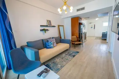 a living room with a couch and some chairs at King 1 Bed Apt with rooftop pool C202 in Miami Beach