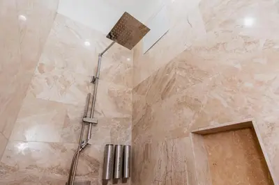 a shower with a shower head in a bathroom at The Link Hotel South Beach in Miami Beach