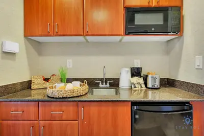 a kitchen with a sink and a microwave at Deluxe Studio Balcony Bay View Amazing Pool in Sunny Isles Beach
