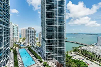 an aerial view of a tall building with a pool at ICON Brickell Miami- 2 bedroom Condo with City and water views! in Miami