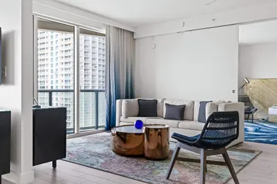 a living room with a couch and a table at 2BR Fort Lauderdale W Residence with Double Living Room, Ocean & Intercoastal Views, Brand New Sofas! in Fort Lauderdale