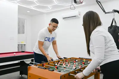 a man and a woman playing a game of snooker at LuxOasis Getaway Minigolf, Pool, Beach, Chess, Jacuzzi in Tamiami