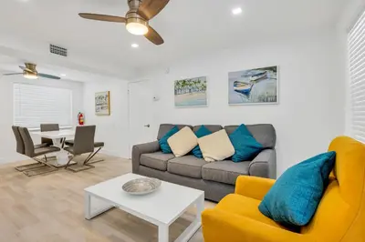 a living room with a couch and a table at ULTRA joyful apartment perfect for families in Hollywood