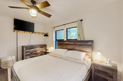 a bedroom with a bed and a ceiling fan at Entertainer's Paradise in Fort Lauderdale