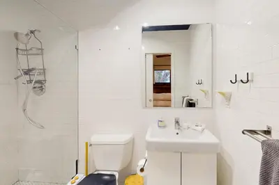 a white bathroom with a sink and a toilet at Entertainer's Paradise in Fort Lauderdale