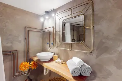 a bathroom with a sink and a mirror at Entertainer's Paradise in Fort Lauderdale