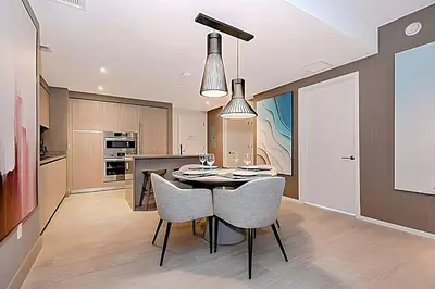 a kitchen and dining room with a table and chairs at Luxury 2 Br Oceanfront Balcony Beautiful Amenities in Hollywood