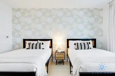 two beds sitting next to each other in a bedroom at Amazing Studio Infinity View Balcony in Hallandale Beach