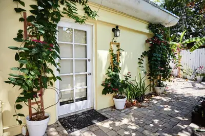 a front door of a house with potted plants at Private Villa Miami Pool Oasis in Miami