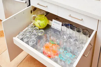 a drawer with glasses and a vase in a kitchen at Private Villa Miami Pool Oasis in Miami