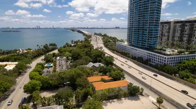 an aerial view of a city with a river and buildings at B01 Minutes from the beach Studio Midtown Wynwood in Miami