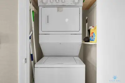 a white refrigerator with its door open in a kitchen at Luxury High Resort Beautiful Views & Amenities in Hallandale Beach