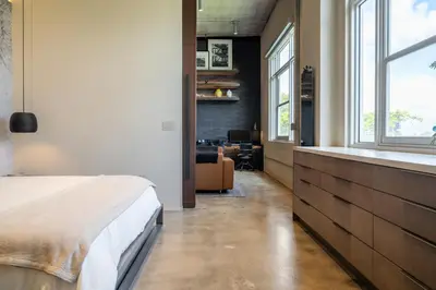 a bedroom with a bed and a desk in a room at Wynwood Condo, Walk to Restaurants and Nightclubs! in Miami