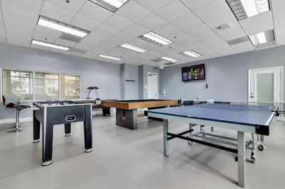 a room with two ping pong tables in it at Serene View 1 BR in Miami