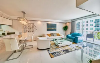 a living room with a couch and a table at Serene View 1 BR in Miami