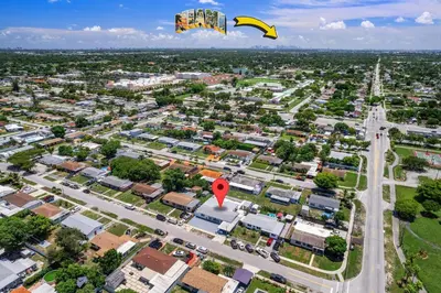 a kite flying over a city with a street at Cozy Apartment with a luxury King Bed in Miami Gardens