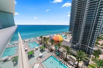 a view of the beach and the ocean from a building at Oceanfront Luxury Condo With WaterView in Hollywood