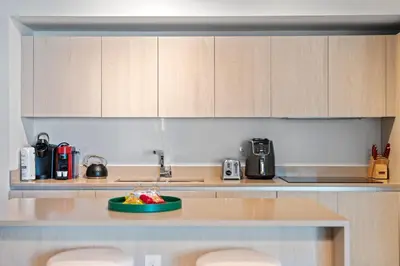 a kitchen with a plate of fruit on a counter at Oceanfront Luxury Condo With WaterView in Hollywood