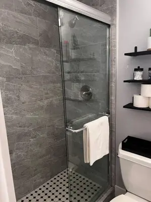 a shower with a glass door in a bathroom at Luxurious Westchester Home Near Miami Clinics in Miami