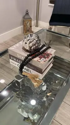 a glass table with a book and a rosary on top at Luxurious Westchester Home Near Miami Clinics in Miami