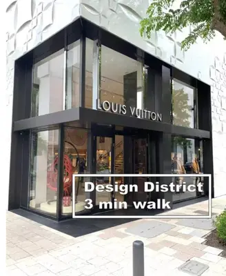 a building with a sign that reads vision district min walk at B03 Location! Studio close 2 Beach & Design District in Miami