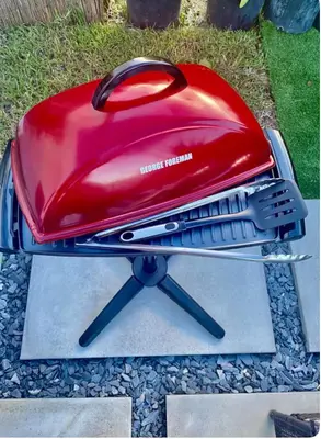 a red toaster sitting on top of a grill at Tropical Studio in Miami
