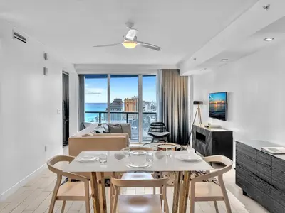 a living room with a table and chairs at FLL W Residence Penthouse, AMAZING birds eye views! in Fort Lauderdale