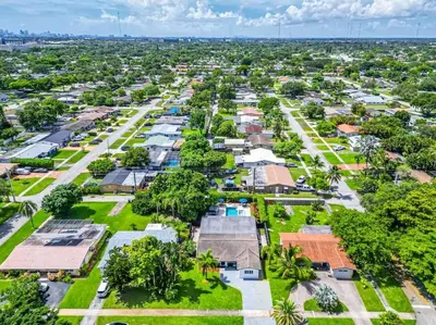 an aerial view of a village with houses and trees at Spacious 5 Bedroom Heated Pool and Hot Tub, 12 minutes to the Beach in Hollywood