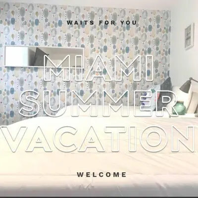 a bedroom with a sign that says imam summer vacation at B04 7 minutes from the beach Midtown Miami in Miami