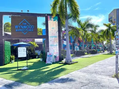 a sign for the wynwood marketplace with palm trees at B04 7 minutes from the beach Midtown Miami in Miami