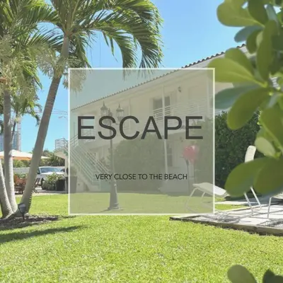 a sign that says escapevery close to the beach at B05 Nicest 1 bedroom APT in Midtown Miami in Miami