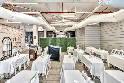 a dining room with white tables and white chairs at Double Queen Room-Hosted by Sweetstay in Miami Beach