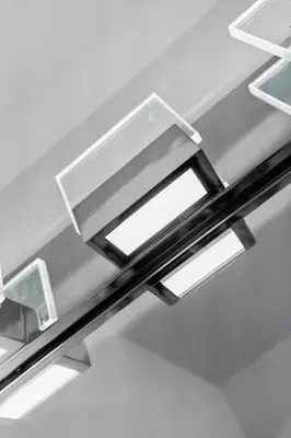 a stainless steel table with three lights on it at Beautiful Apt 5min walking Design District apt 1 in Miami