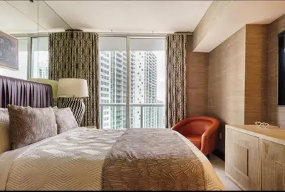 a bedroom with a bed and a large window at Luxurious Stunning Views condo in Miami