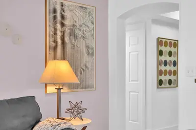 a living room with a lamp and a couch at Serene Cozy Retreat with Balcony Free Parking in Miami