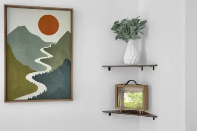 a picture and a vase with a plant on a shelf at Serene Cozy Retreat with Balcony Free Parking in Miami