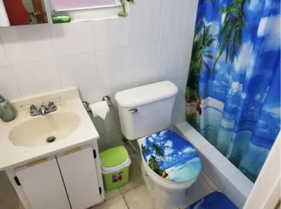 a bathroom with a toilet and a sink and a shower at Coco Sol 2 by MyMiamiStay in Miami