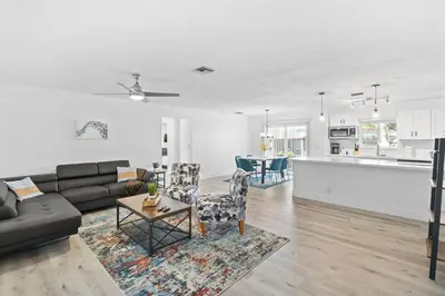a living room with a couch and a table at Weekly Discounts 10 min to Beach by TilahStays in Fort Lauderdale