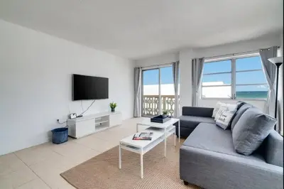 a living room with a couch and a tv at 1101- Luxurious 1BR & 2 Bath with City & Ocean Views in Miami Beach