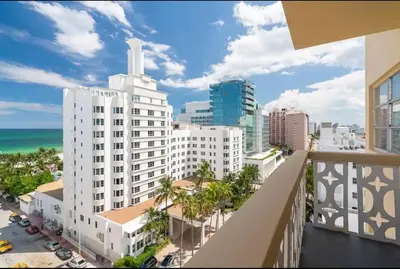 a balcony with a view of a city and the ocean at 1101- Luxurious 1BR & 2 Bath with City & Ocean Views in Miami Beach