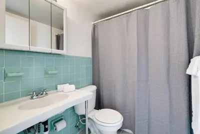 a bathroom with a toilet and a sink and a shower at 1106- 1BR & 1BA with Balcony, Stunning City & Ocean Views in Miami Beach