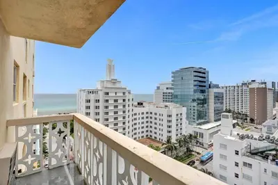 a balcony with a view of the ocean and buildings at 1506- 1BR & 1BA Retreat with Stunning Intracoastal Views in Miami Beach