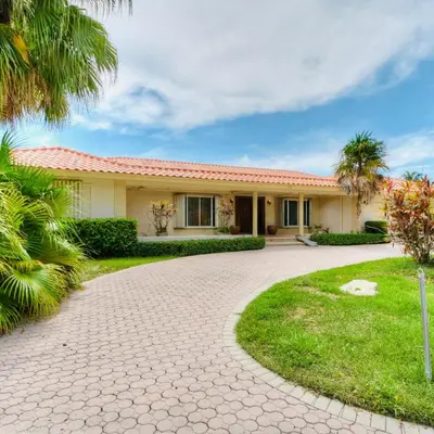 a house with a driveway in front of it at Fort Lauderdale Beach Oasis in Fort Lauderdale