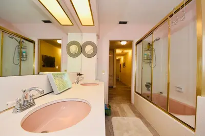 a bathroom with two sinks and a shower at Fort Lauderdale Beach Oasis in Fort Lauderdale