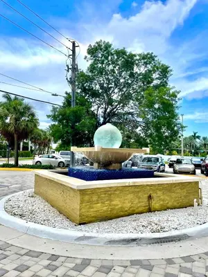 a large fountain in the middle of a parking lot at Luxurious Waterfront 2 room apartment- Remodeled- Free parking- 5min drive to Miami Beach in Miami Beach